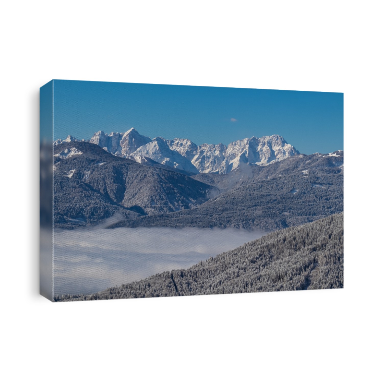 Scenic view of mountain summit Jof di Fuart (Vis) and Jof di Montasio in Julian Alps seen from Kobesnock near Bad Bleiberg, Carinthia, Austria, Europe. Heavy snow covered winter wonderland landscape